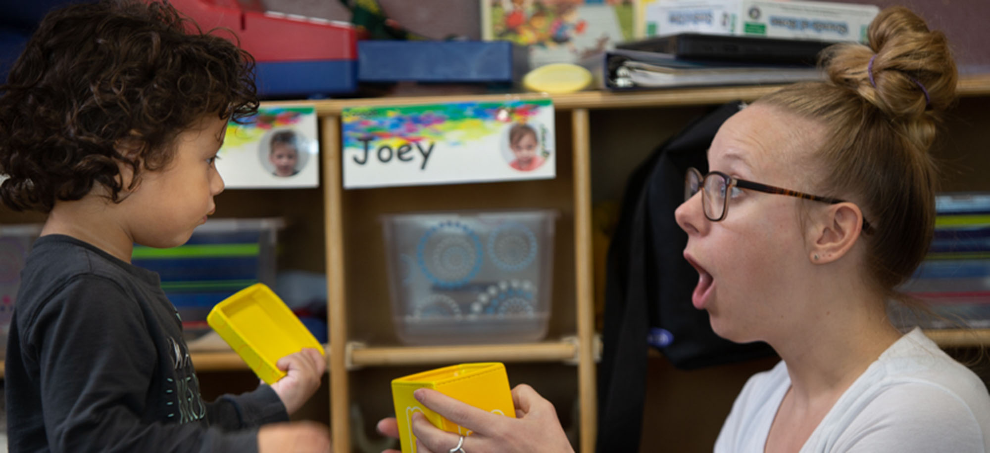 child care worker with toddler