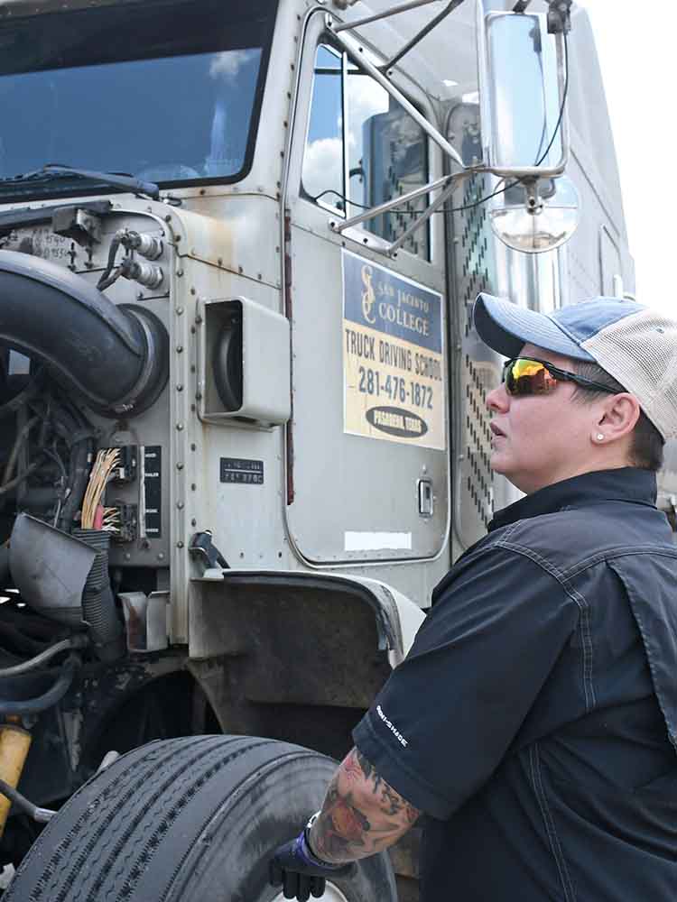 trucker inspecting truck