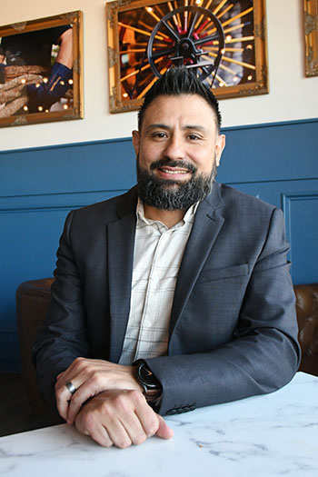 Luis Pedro Perez sitting at coffee shop